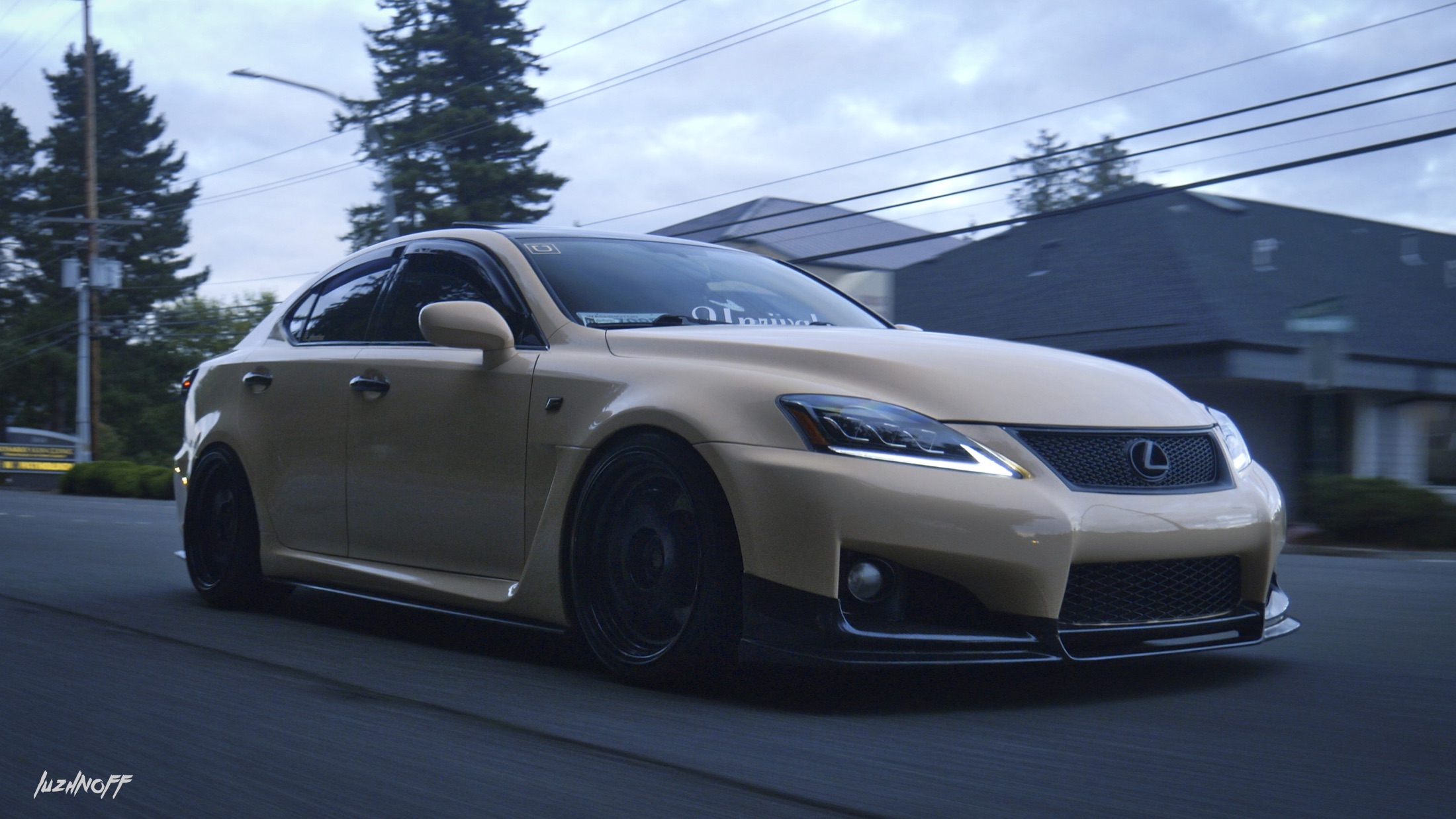 Lexus driving through a city street