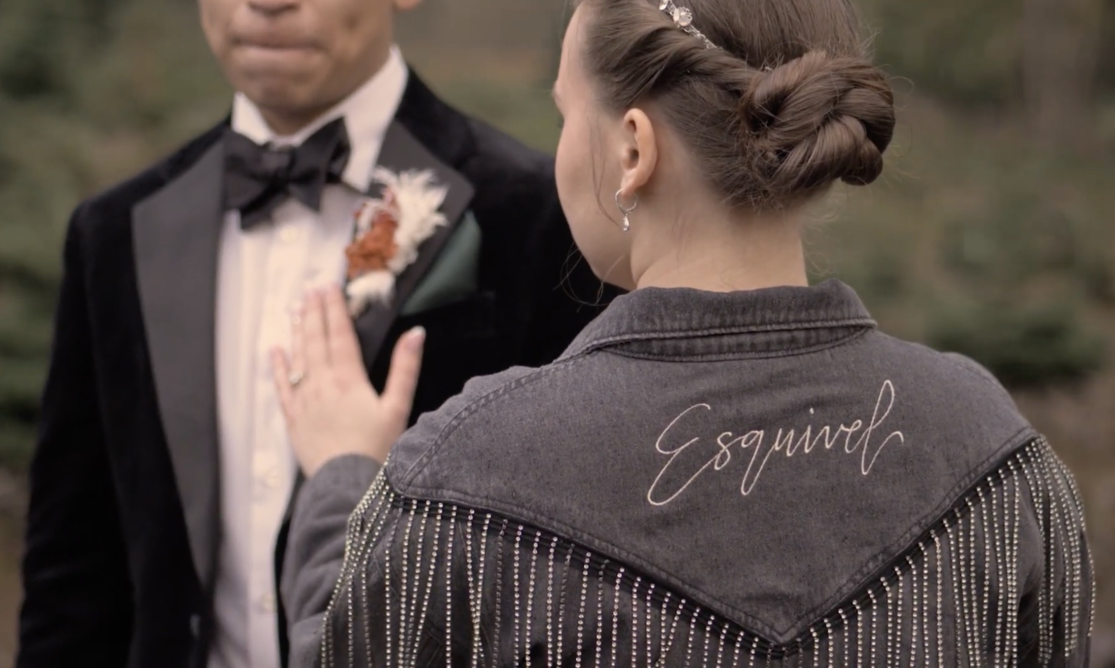 Bride showing her ring before a wedding portrait